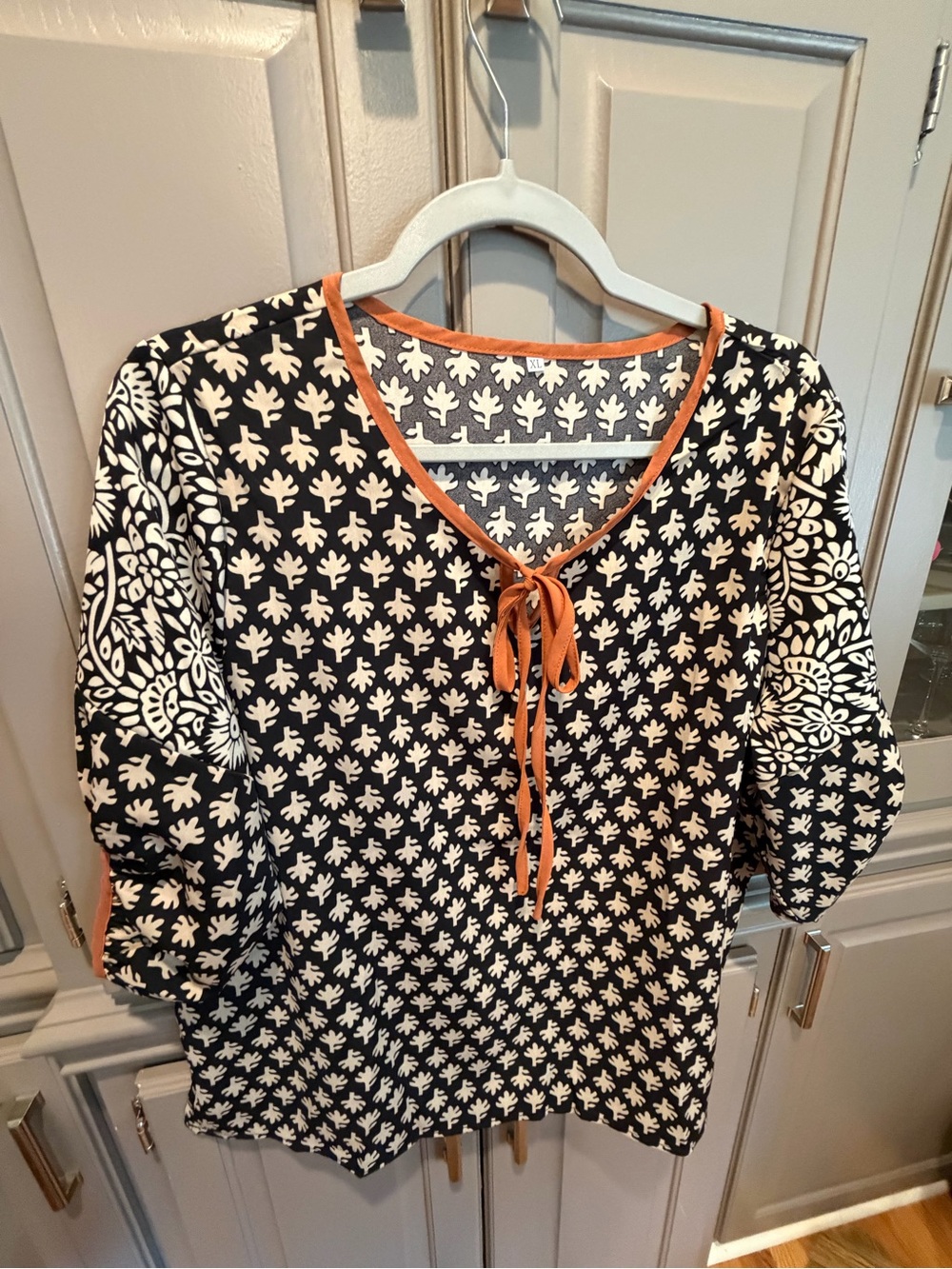 SHEIN Black & White Patterned Blouse with Orange Trim